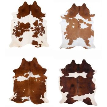 LG/XL Brazilian Brown and White hair on cowhide rug. Measures approx. 42.5 - 50 square feet